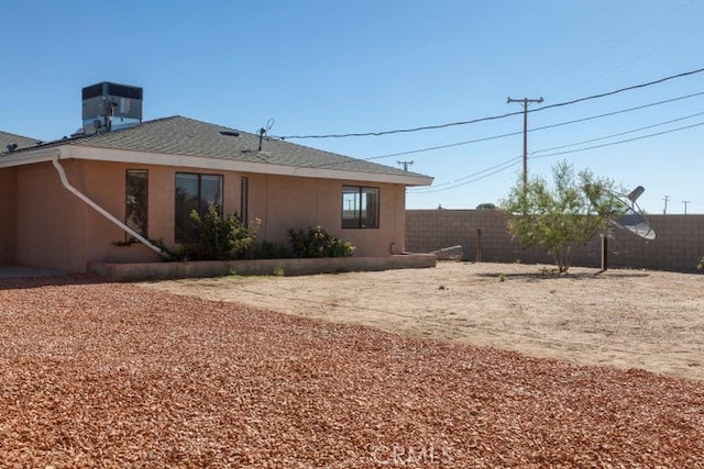 back of property with fence