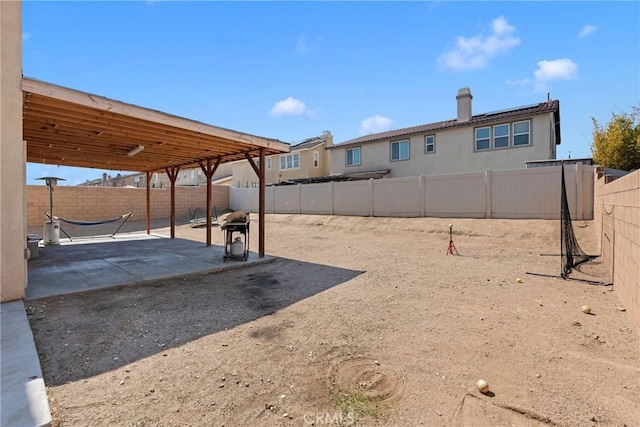 view of yard featuring a patio area and a fenced backyard