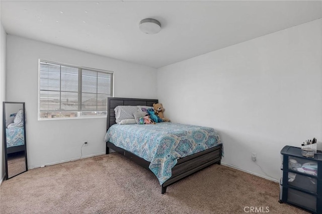 bedroom featuring carpet