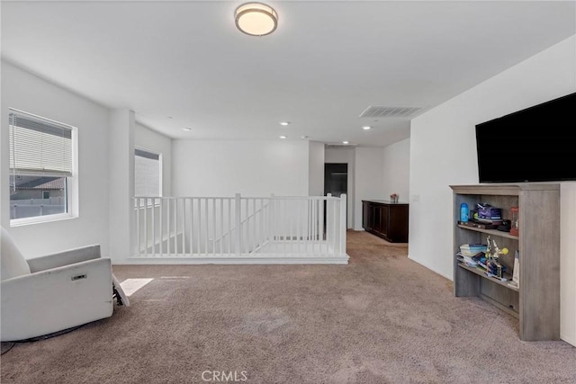 empty room with recessed lighting, visible vents, and carpet floors