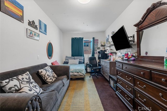 living area featuring dark colored carpet