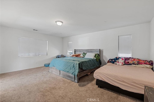 bedroom featuring visible vents and carpet floors