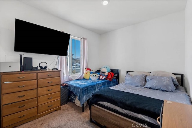 bedroom with light carpet