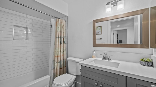 bathroom with shower / tub combo, toilet, and vanity