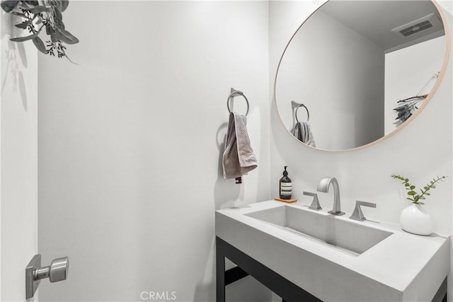 bathroom with visible vents and vanity