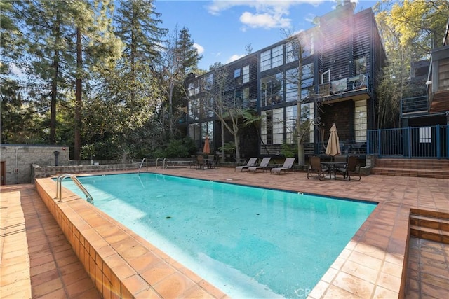 pool with a patio area