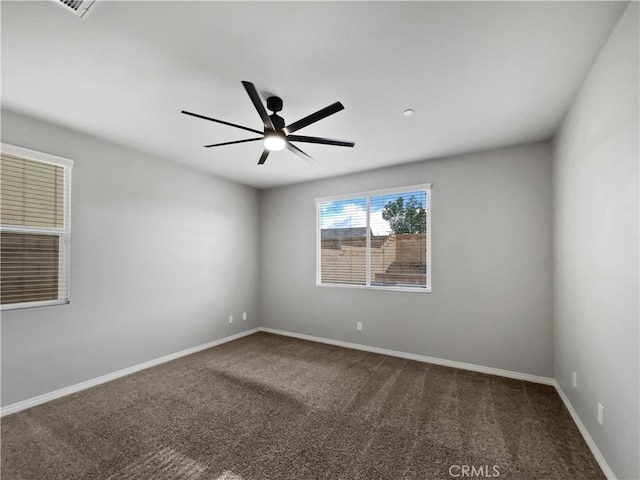 carpeted empty room with baseboards and ceiling fan