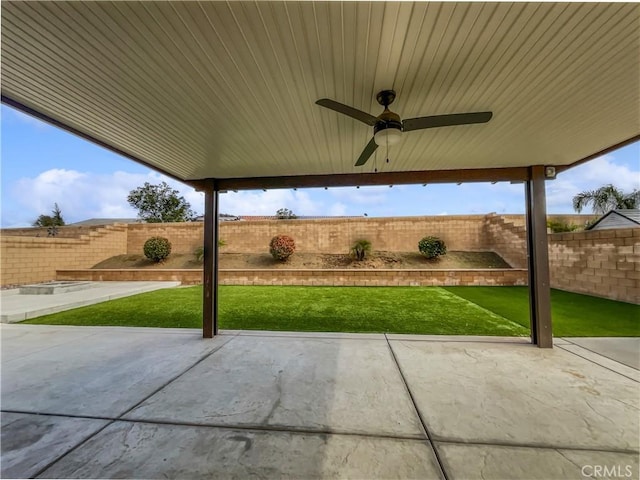 view of patio / terrace with a fenced backyard and a ceiling fan