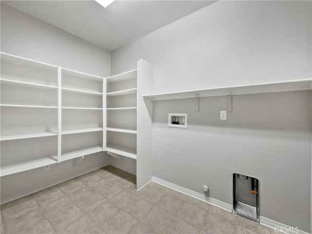 laundry area featuring washer hookup, laundry area, baseboards, and gas dryer hookup