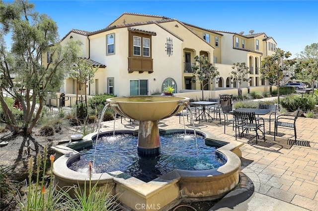 view of property's community featuring a patio area