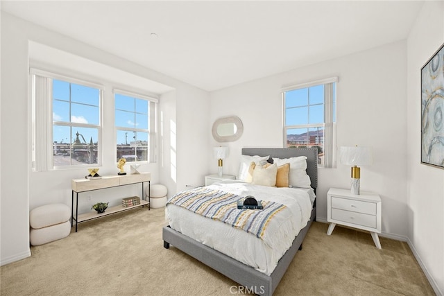 bedroom with carpet flooring and baseboards