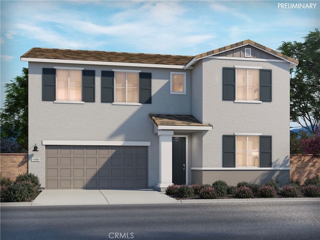 traditional-style home featuring stucco siding, concrete driveway, and a garage