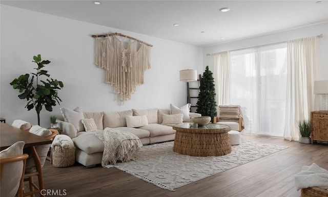 living area with recessed lighting and wood finished floors