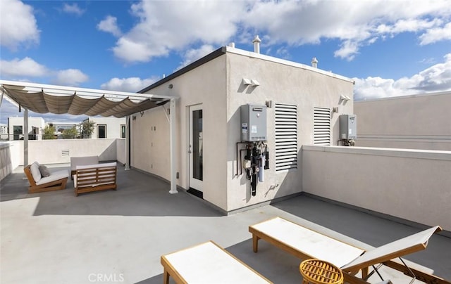 back of property featuring stucco siding, an outdoor hangout area, and a patio