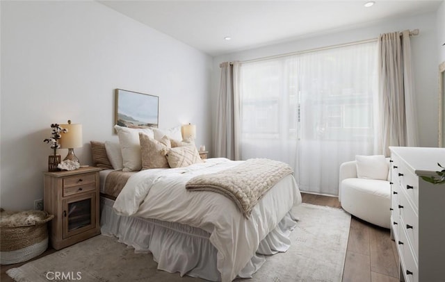 bedroom featuring recessed lighting and light wood-style floors