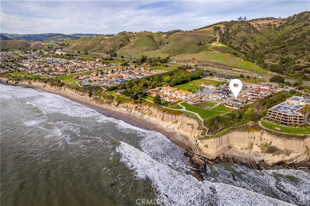 aerial view featuring a water and mountain view