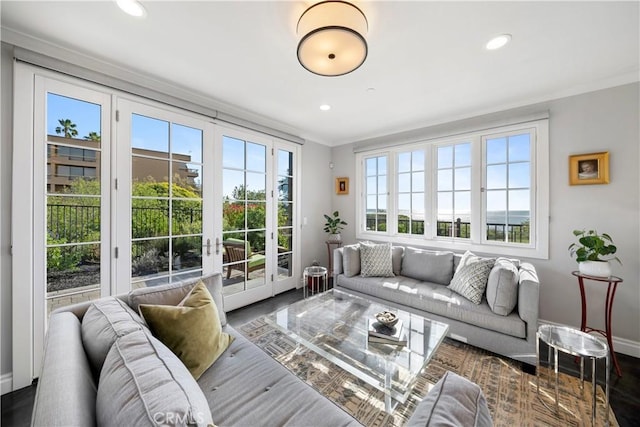 sunroom / solarium featuring french doors