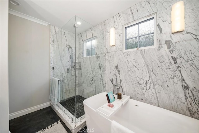 full bath with a marble finish shower, recessed lighting, a freestanding bath, and baseboards