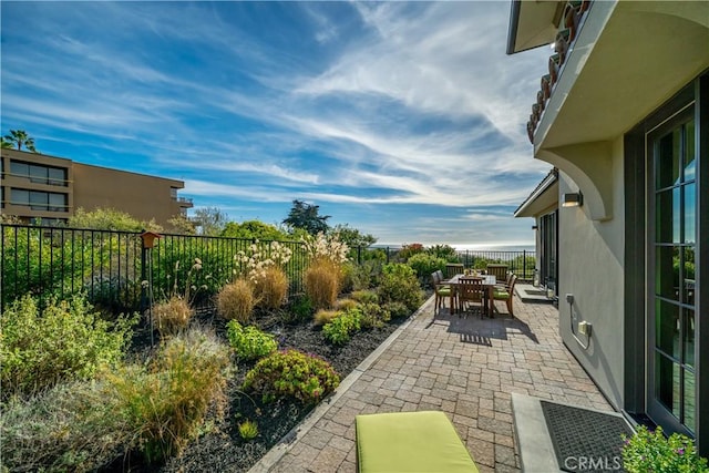 view of patio / terrace featuring outdoor dining area and a fenced backyard