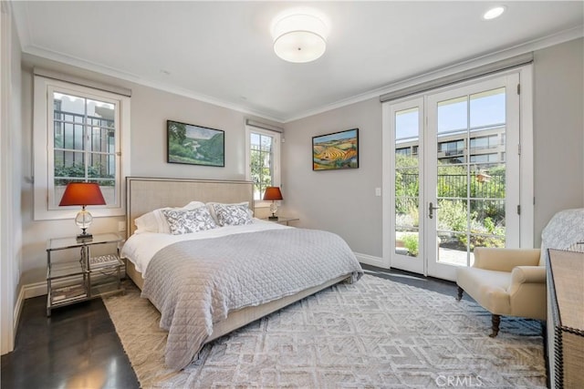 bedroom featuring ornamental molding, wood finished floors, baseboards, and access to outside