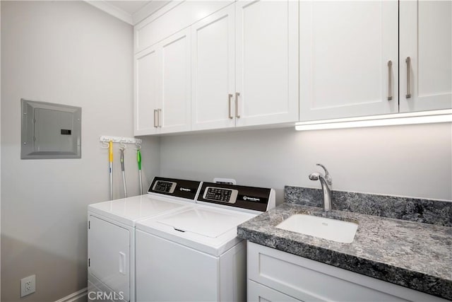 laundry room with ornamental molding, electric panel, a sink, cabinet space, and washing machine and clothes dryer