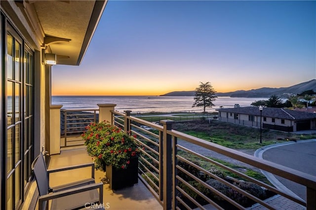 balcony at dusk with a water view