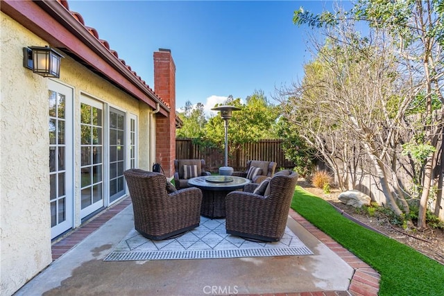 view of patio / terrace featuring fence
