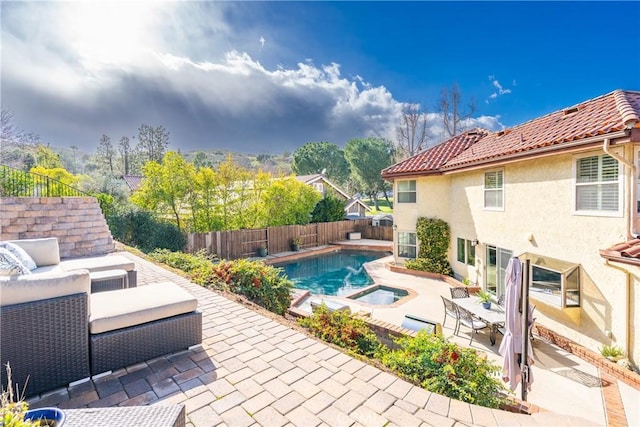 view of swimming pool featuring a fenced backyard, a fenced in pool, an outdoor hangout area, and a patio