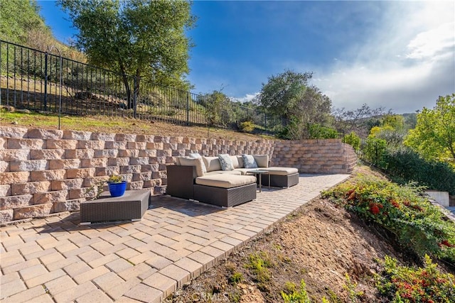 view of patio / terrace featuring an outdoor living space and a fenced backyard