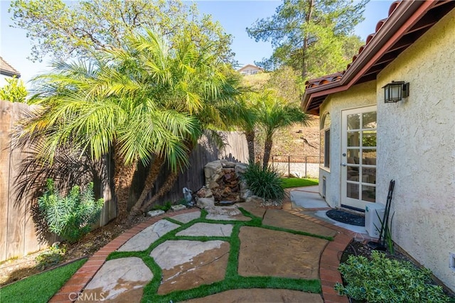 view of yard with a patio area and a fenced backyard