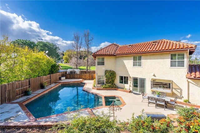 view of swimming pool with a patio area, a fenced in pool, and a fenced backyard