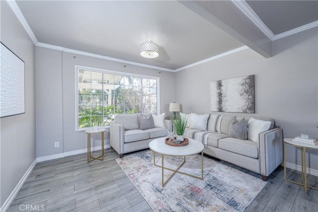 living area with ornamental molding, baseboards, and wood finished floors