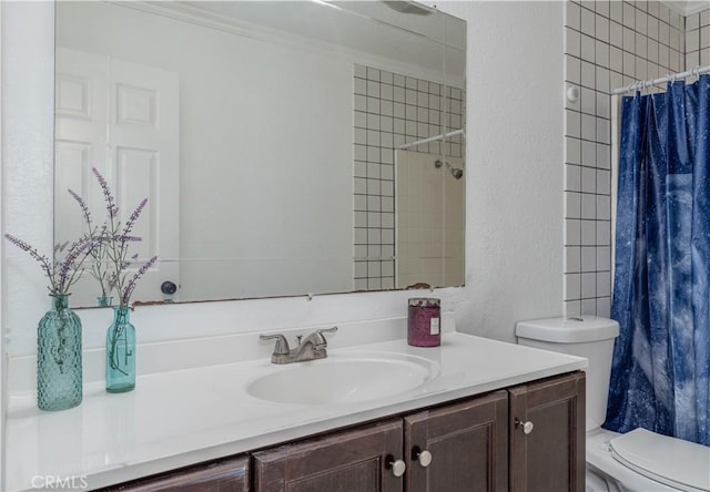 bathroom featuring vanity, a shower with curtain, crown molding, toilet, and a textured wall