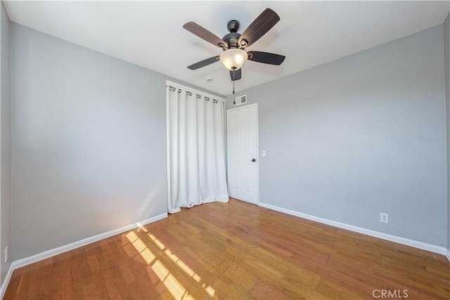 unfurnished bedroom featuring visible vents, baseboards, and light wood-style floors