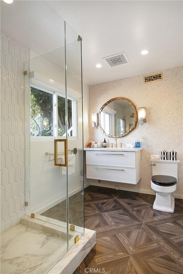 bathroom featuring visible vents, a shower stall, and wallpapered walls