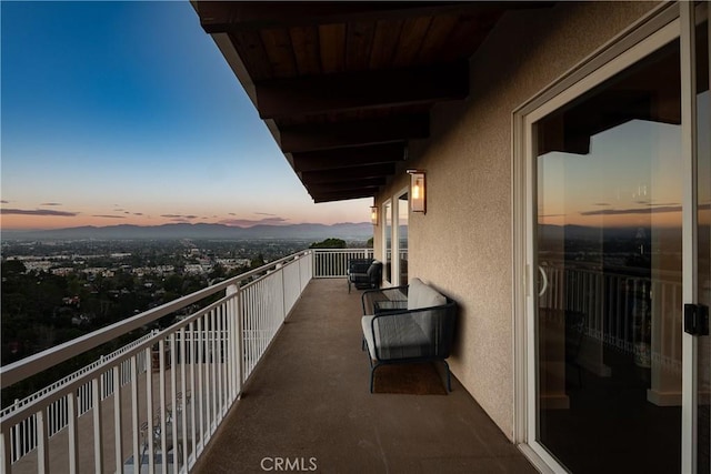 view of balcony at dusk