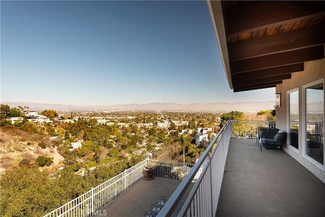 balcony featuring a mountain view