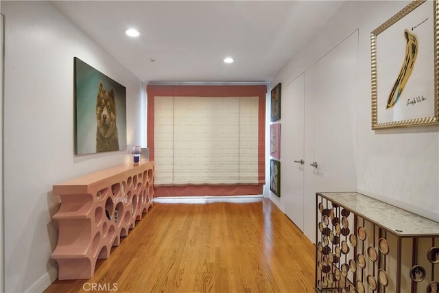 hallway featuring recessed lighting and wood finished floors