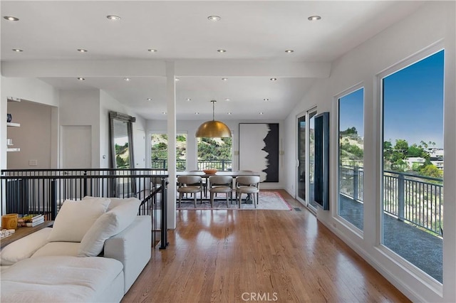 living area featuring recessed lighting, lofted ceiling, and light wood-style floors