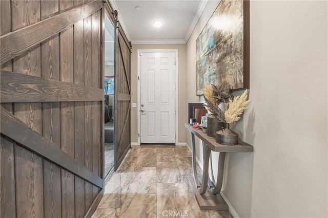 doorway to outside featuring baseboards, crown molding, and a barn door