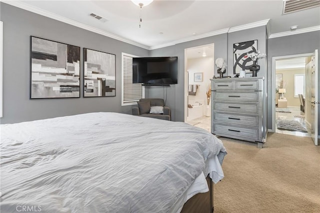 bedroom featuring visible vents, ensuite bath, and carpet flooring