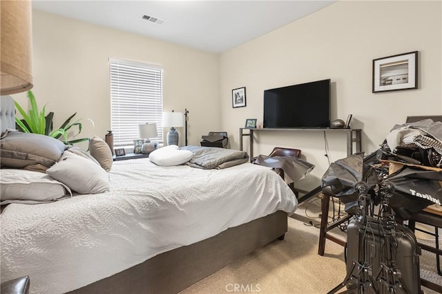 bedroom with visible vents and carpet floors