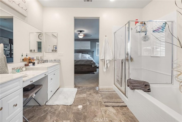 ensuite bathroom featuring visible vents, a shower stall, ensuite bath, and vanity