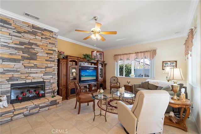 living room featuring visible vents, ornamental molding, a ceiling fan, a stone fireplace, and light tile patterned floors