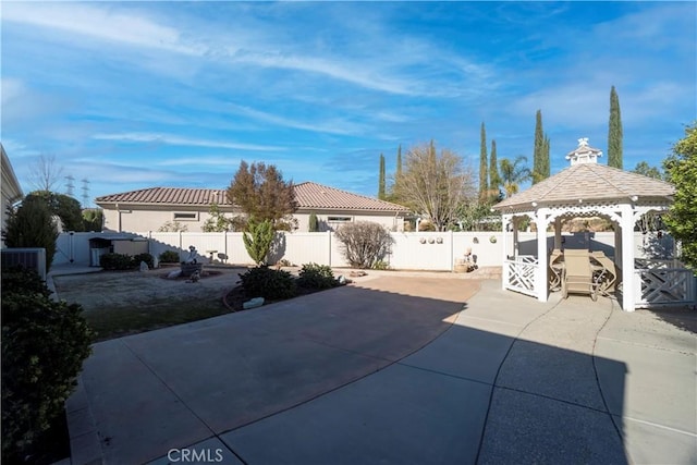 view of patio with a gazebo and a fenced backyard