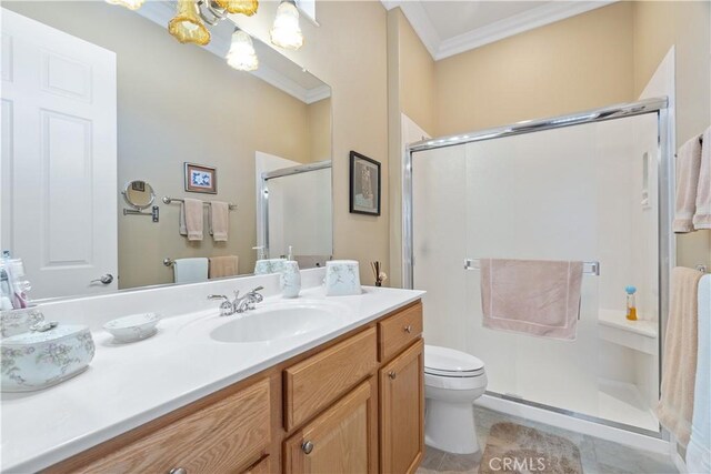 full bathroom featuring tile patterned floors, toilet, a stall shower, ornamental molding, and vanity