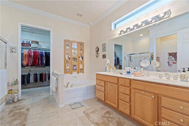 full bathroom with a walk in closet, double vanity, ornamental molding, and a sink