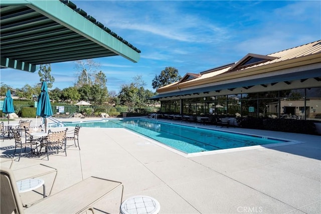 pool with a patio