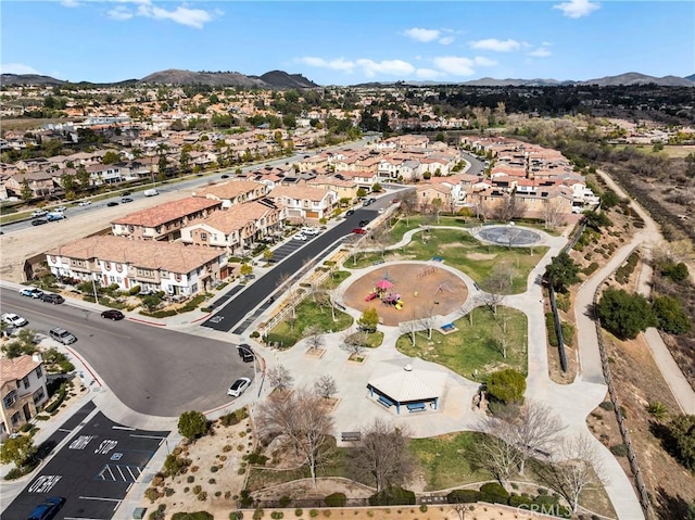 birds eye view of property featuring a mountain view and a residential view