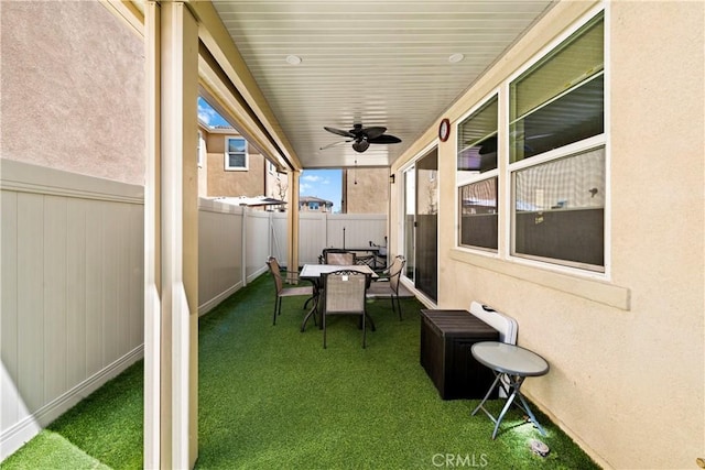 view of patio / terrace with fence private yard and ceiling fan